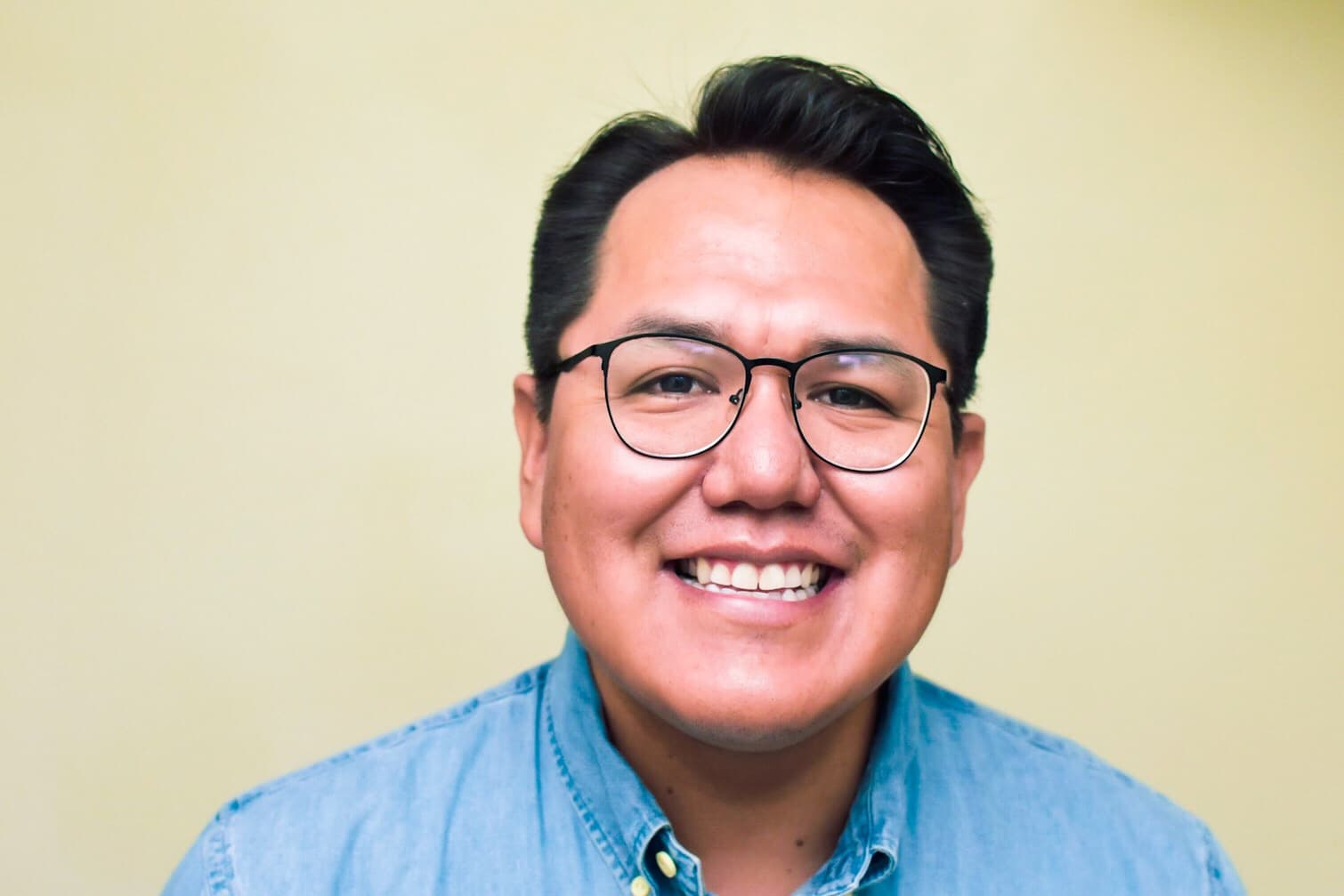 Aaron Yazzie, NASA JPL mechanical engineer, in a professional portrait.
