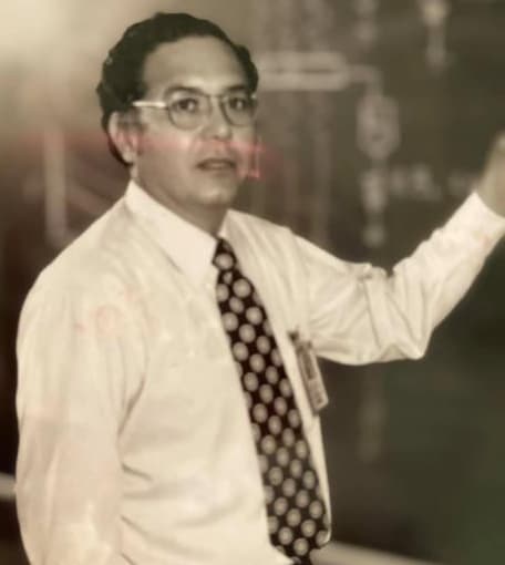 NASA electrical engineer Arturo Campos at a spacecraft systems console.